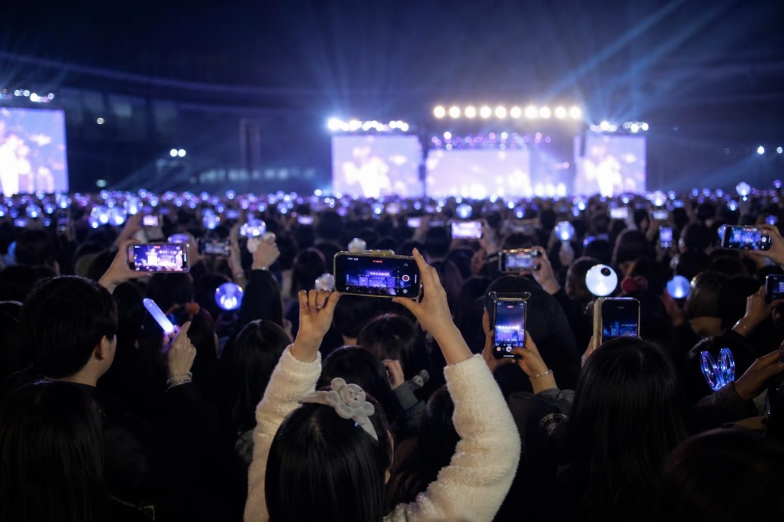 [concert crowd] Image explaining the article's impact and background - The second narrative treats the footage as content rat...
