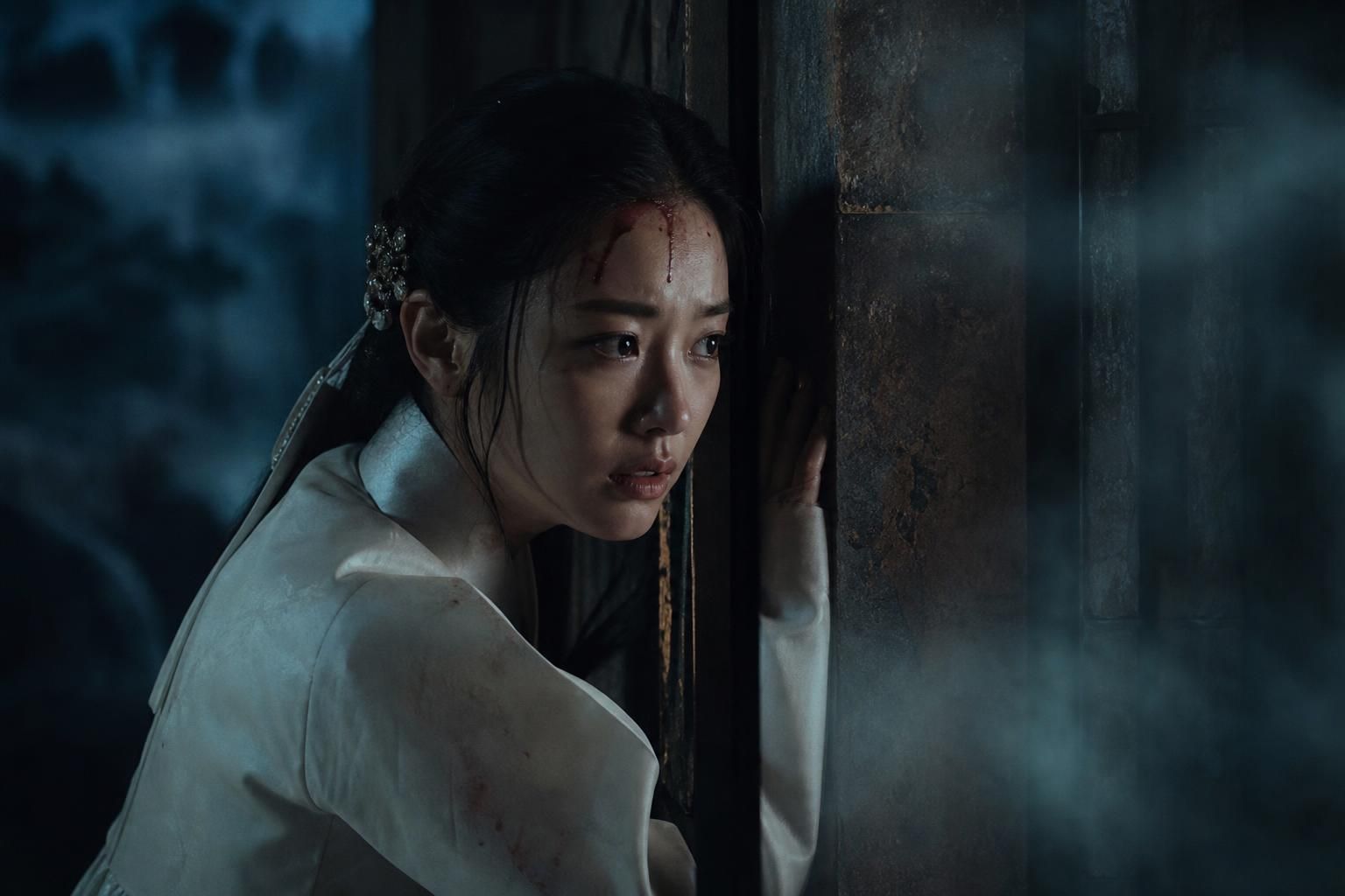 ghost palace Image showing the article's key context - She is depicted with blood on her forehead as she listens closely to v...