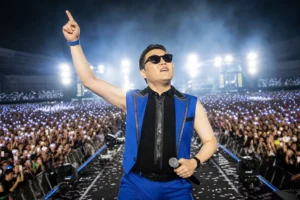 Crowd at a large summer K-pop concert inspired by PSY Summer Swag 2026 opening night
