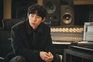 Editorial image of a Korean music producer working in a recording studio after Code Kunst breakup report