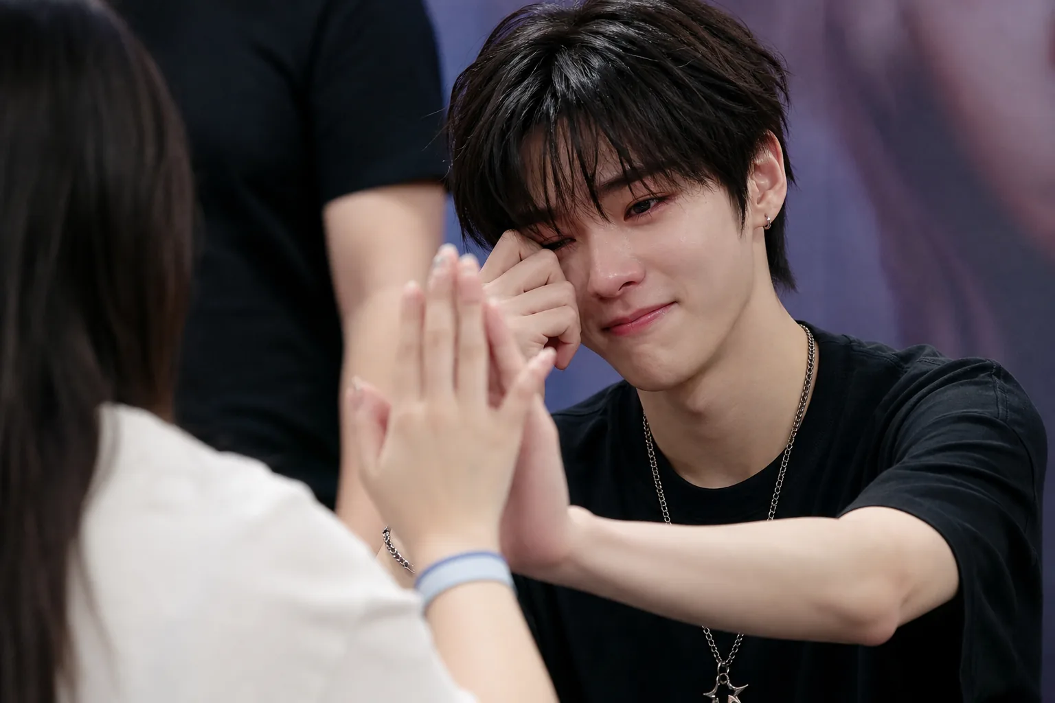 K-pop trainee meeting fans during pre-debut showcase event