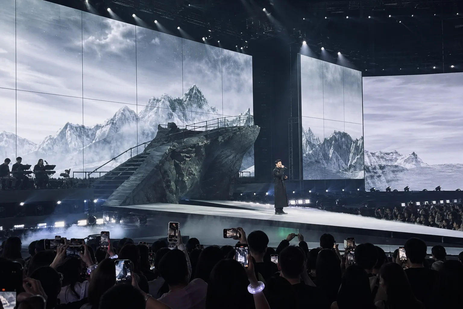 Live music production team improving stage visibility for fans