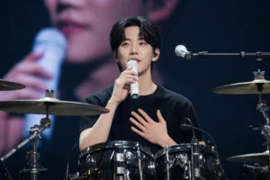 DAY6 concert stage representing Dowoon's message to fans after dating rumors