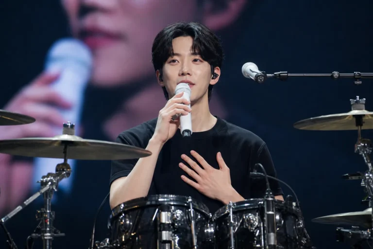 DAY6 concert stage representing Dowoon's message to fans after dating rumors