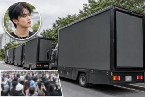 Editorial image representing NCT DREAM fan protest trucks outside an entertainment agency