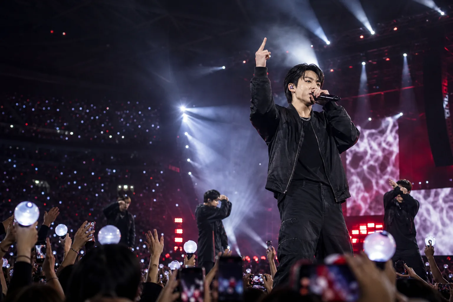 K-pop concert crowd reacting to a dramatic stage moment during a performance