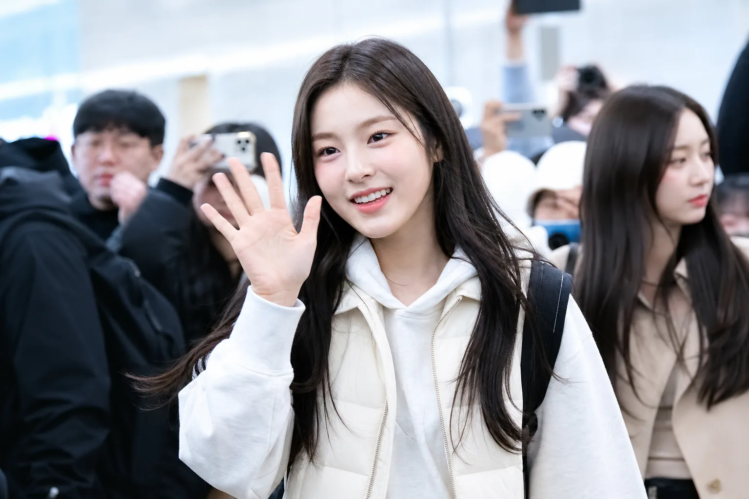 K-pop rookie group airport schedule with cameras and fans