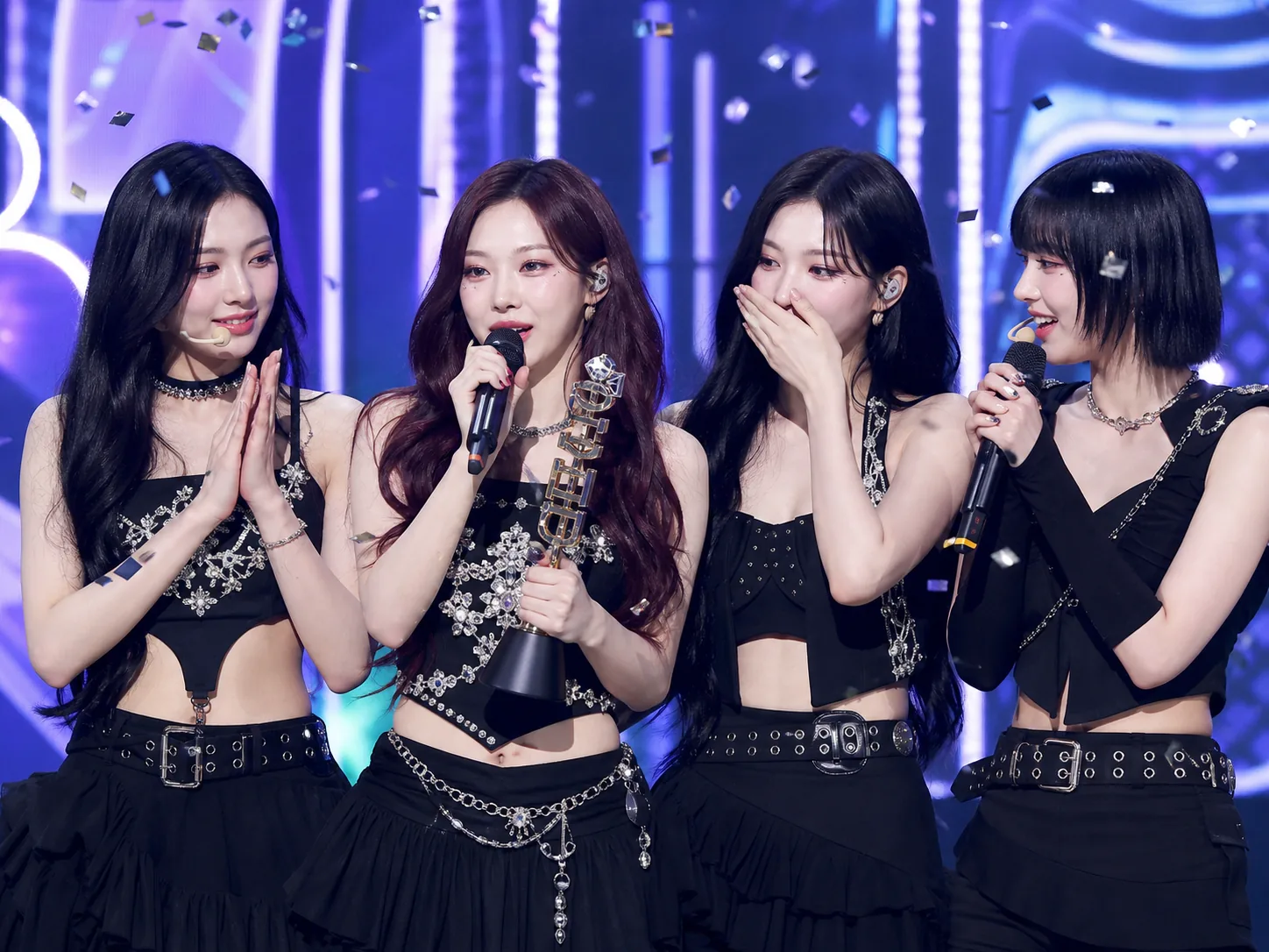 K-pop trophy moment on a televised music show stage