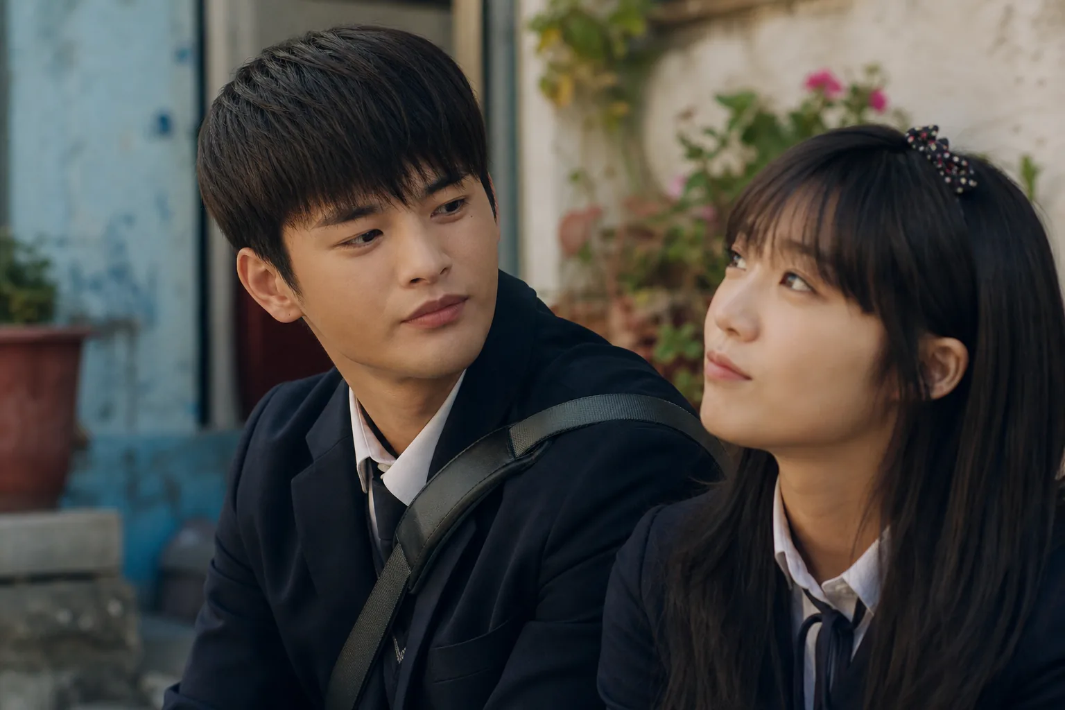 Korean drama actor reviewing scripts for a rom-com role