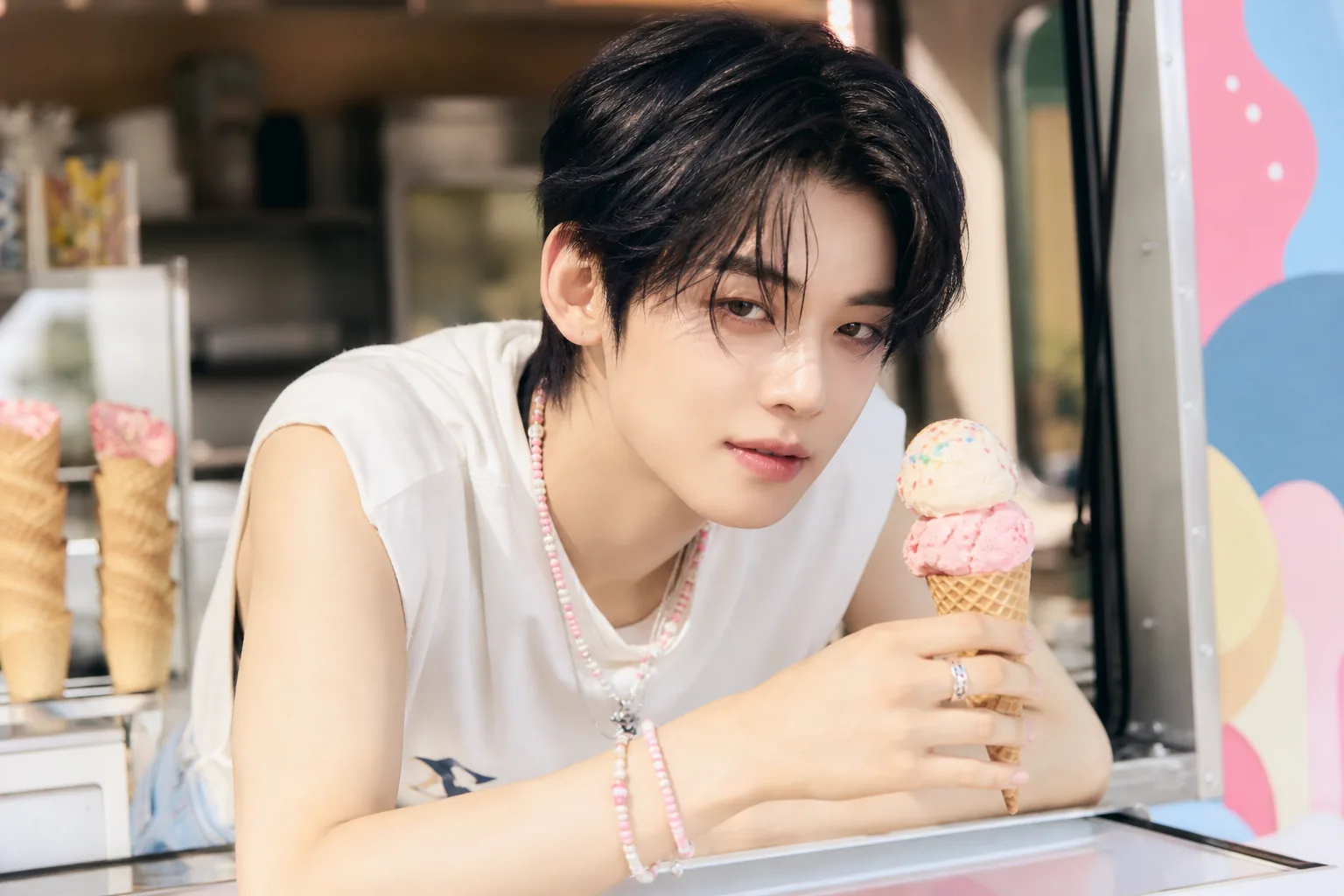 Editorial image explaining a K-pop solo comeback campaign across video and performance