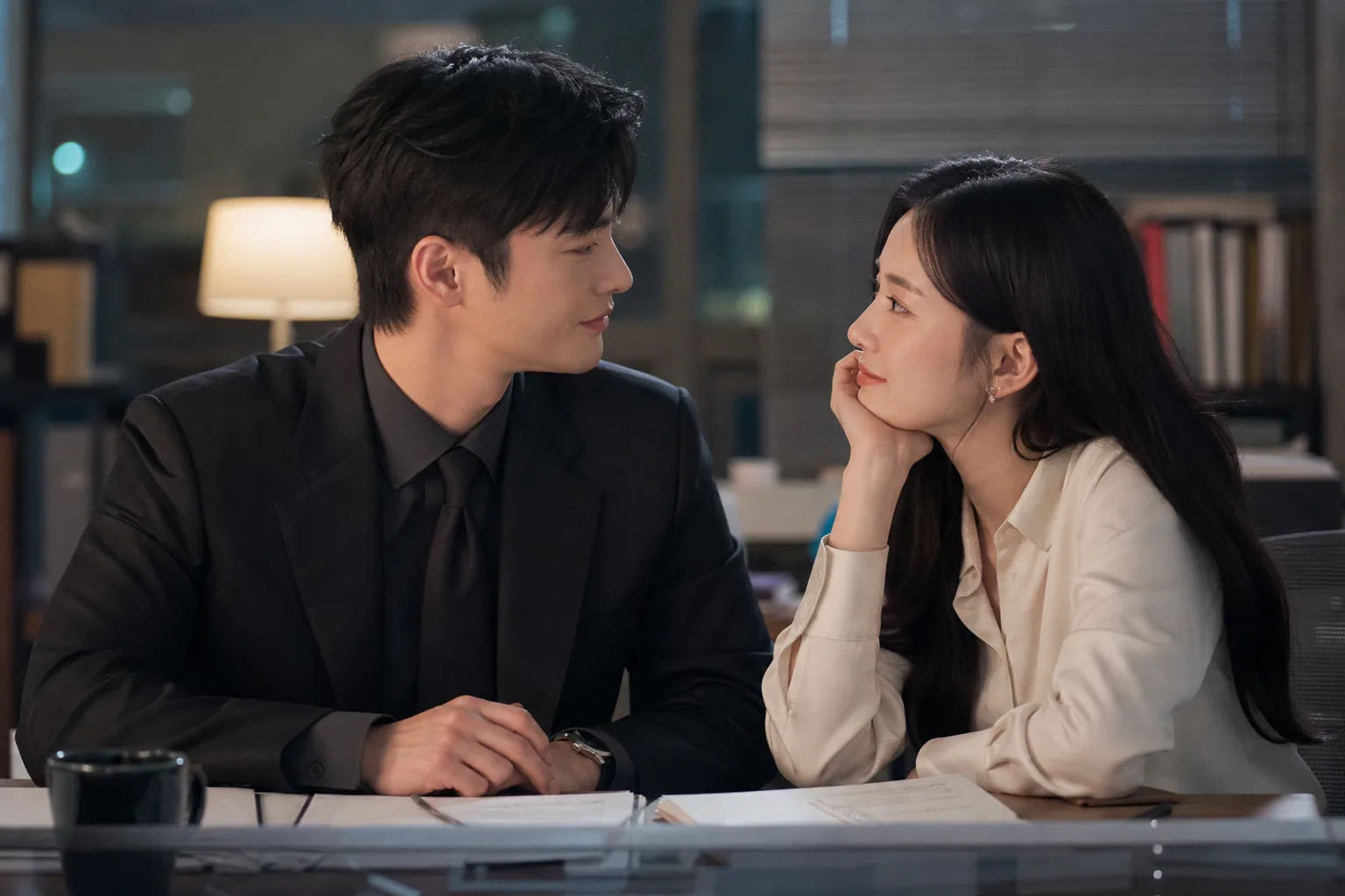 K-drama couple cooking together after work in a romantic home scene