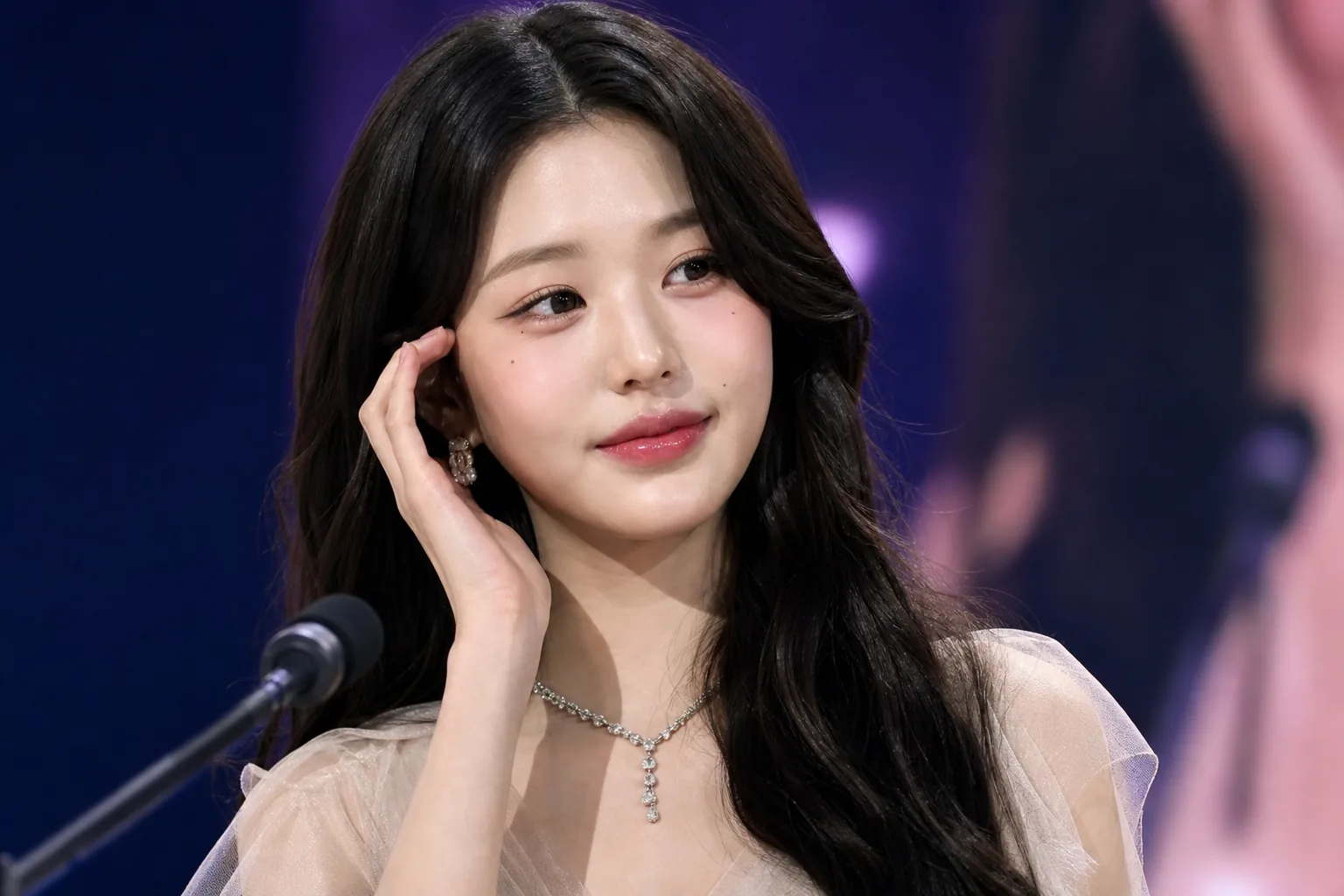 K-pop idol under stage and camera lights reflecting public attention