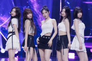 Editorial image of a K-pop performance stage representing RESCENE's chart reversal