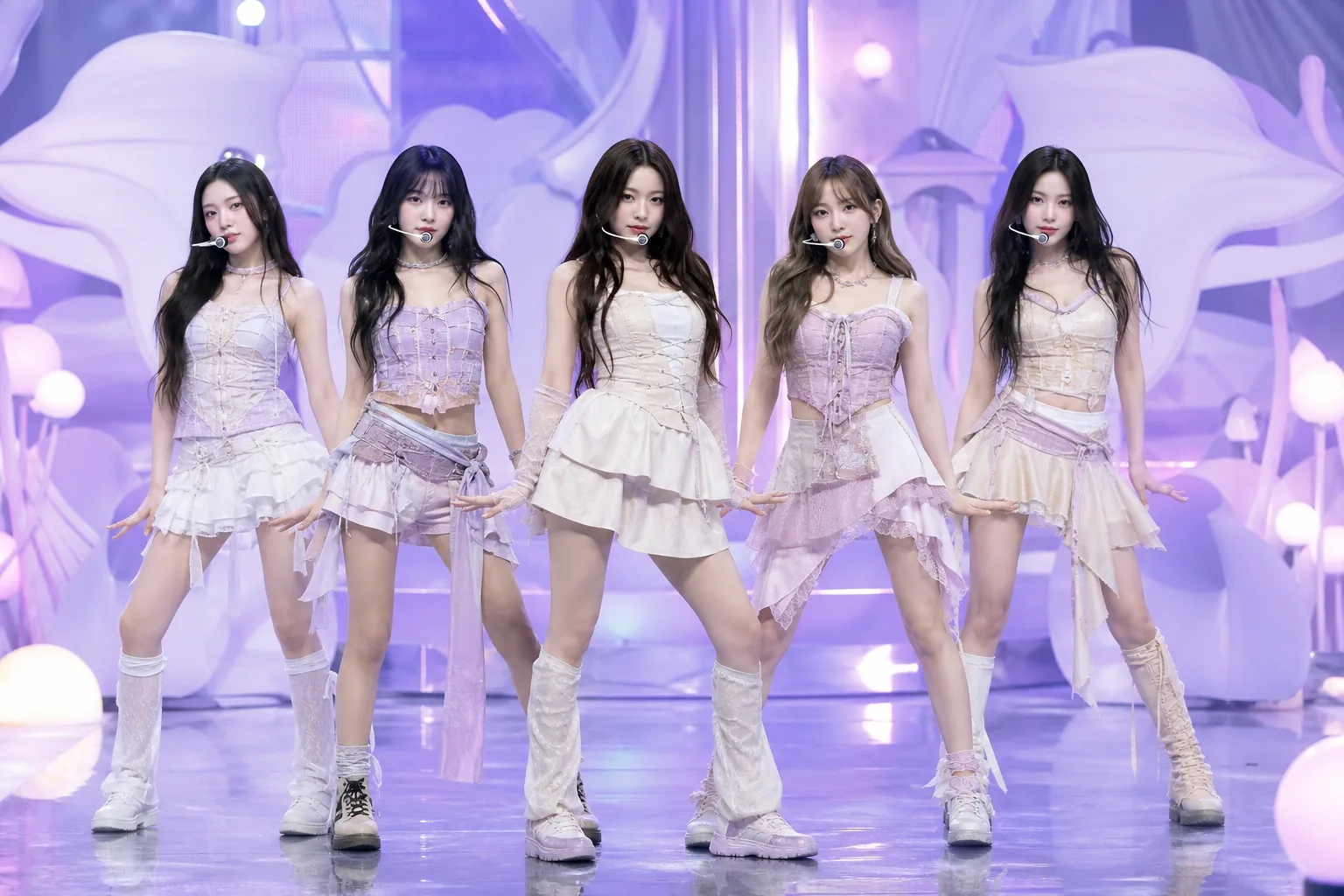 Fans watching K-pop clips on phones as a rookie group gains momentum