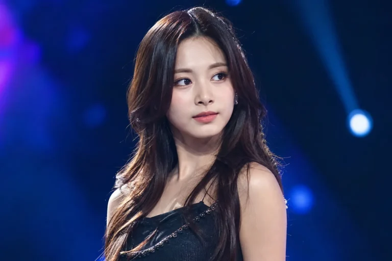 TWICE Tzuyu contract renewal news illustrated with a modern K-pop concert stage