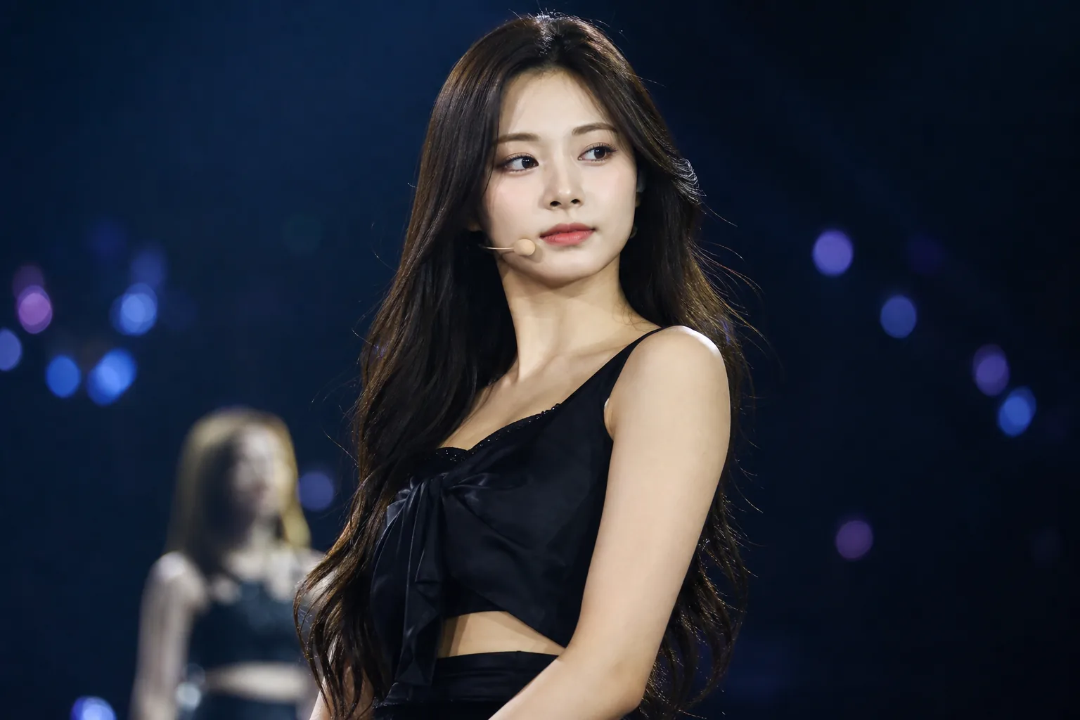TWICE contract renewal discussions illustrated through a professional entertainment news setting