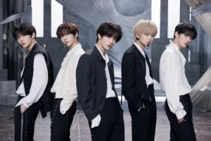K-pop stage lights representing TXT's Deja Vu music video milestone