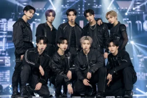 NCT 127 contract renewal news with K-pop concert stage atmosphere