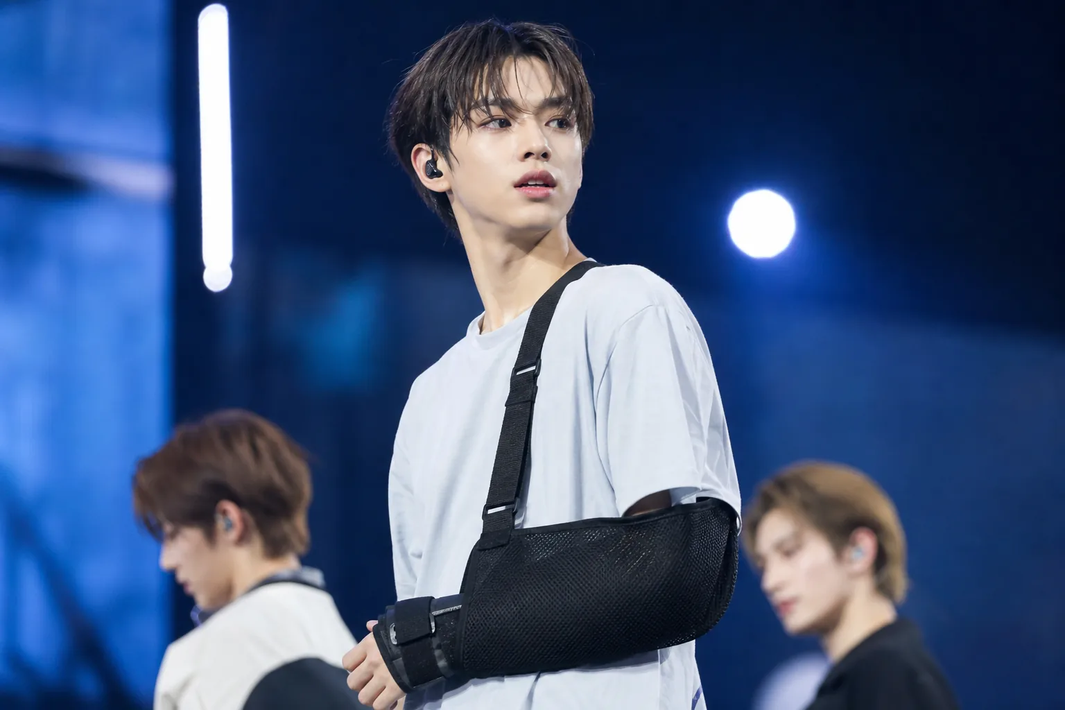 K-pop concert stage with adjusted performance plan for injured artist