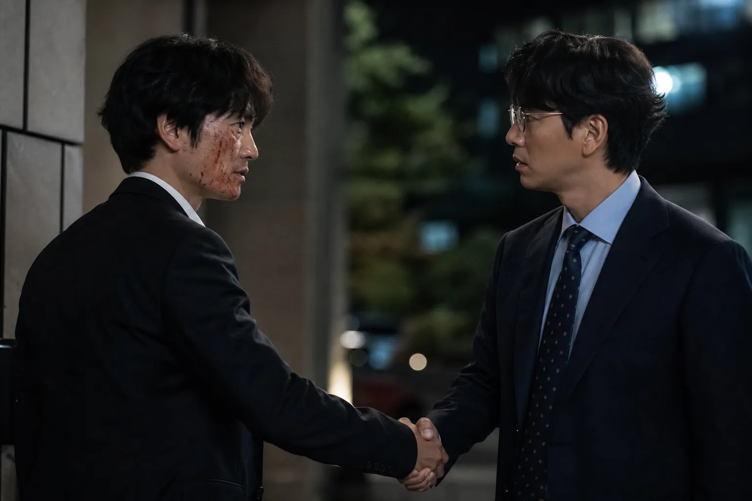 Tense handshake scene inspired by The Apartment Job episode three