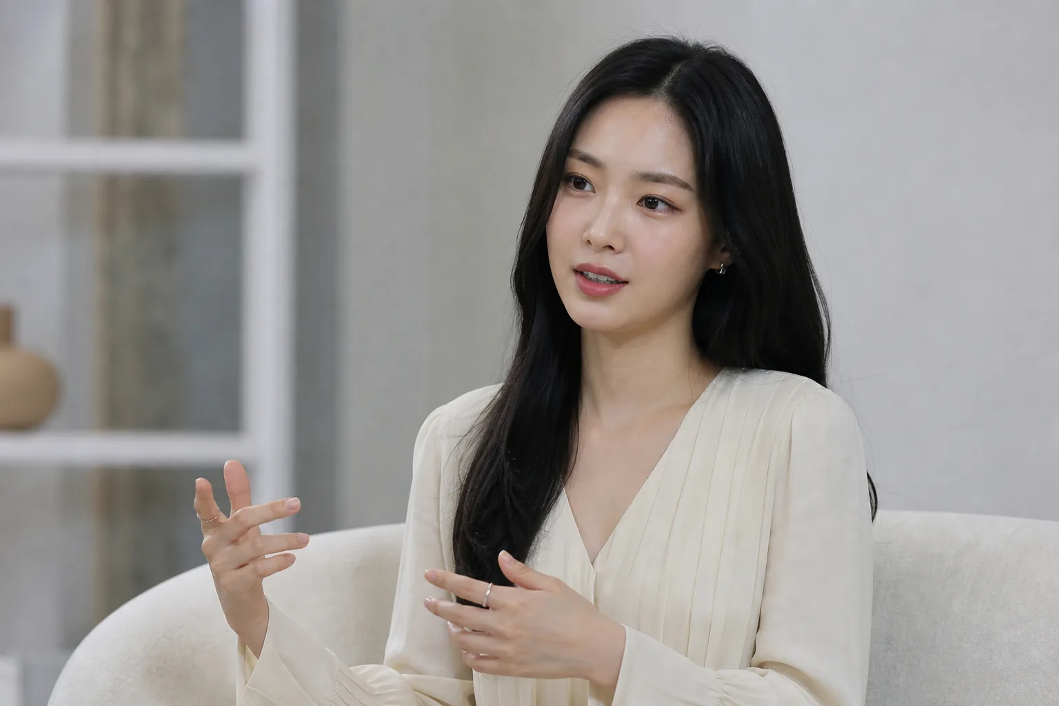 Actress speaking in a studio interview about identity and career growth