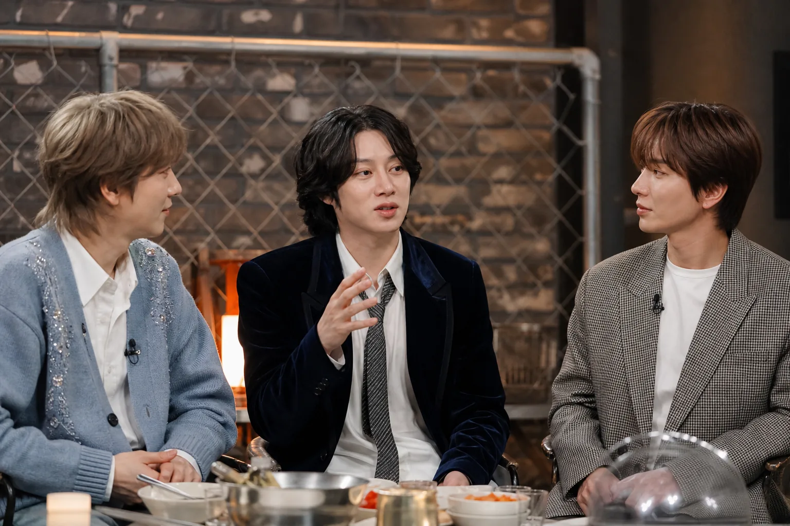 K-pop idols discussing trainee memories in a studio interview
