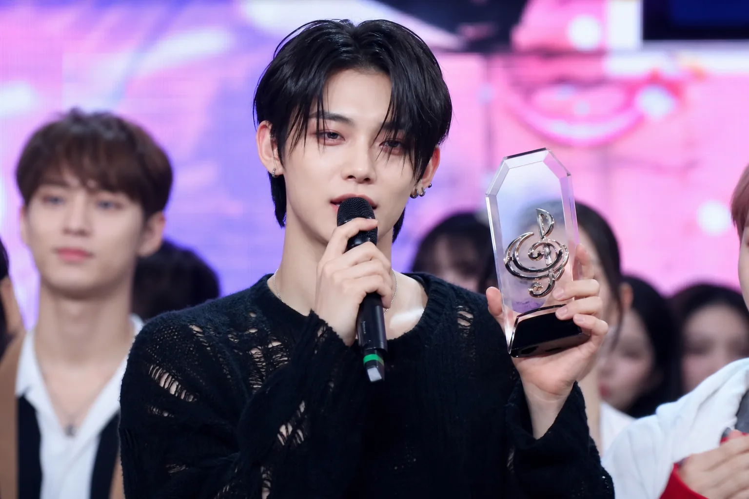Modern K-pop broadcast lineup scene representing Music Core performances