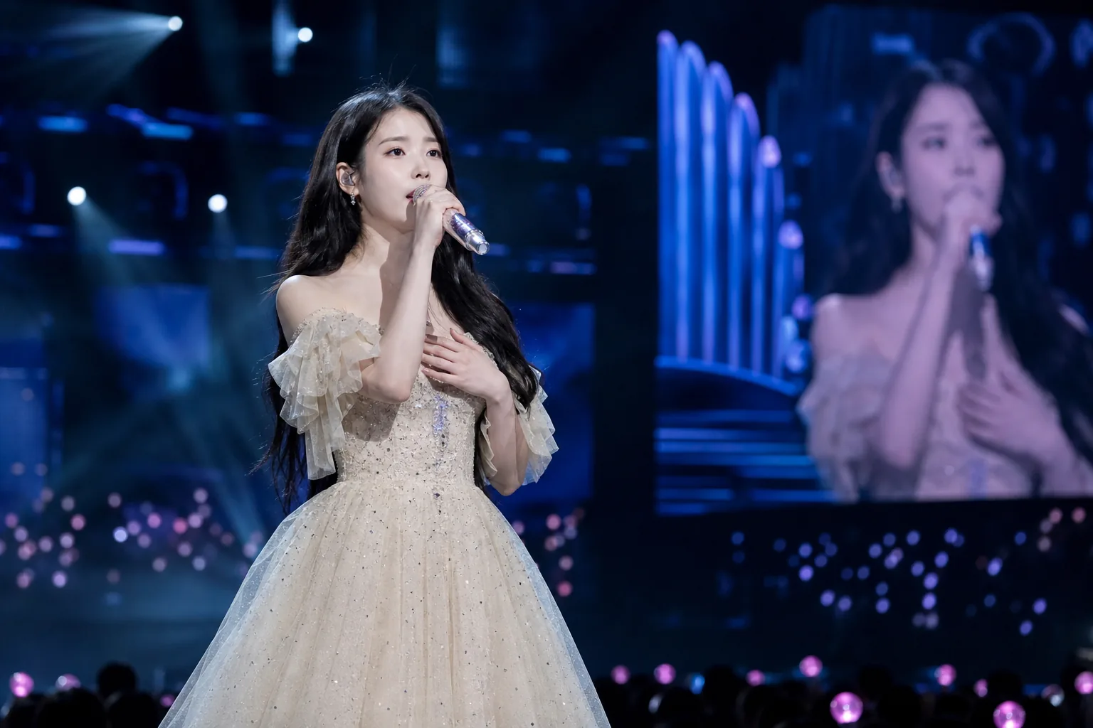 Concert stage representing IU schedule changes after health update