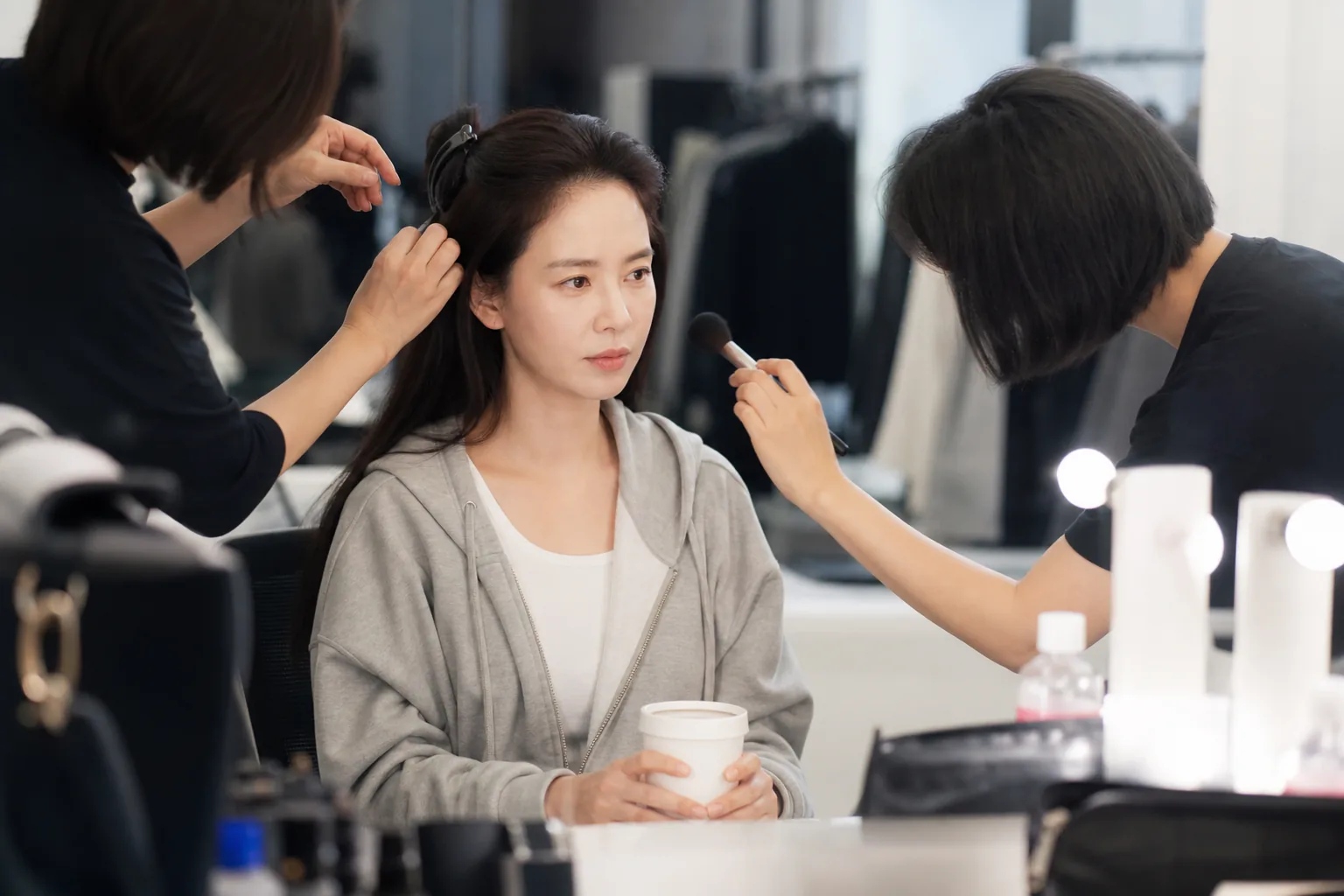 Celebrity styling team preparing a casual Korean entertainment shoot