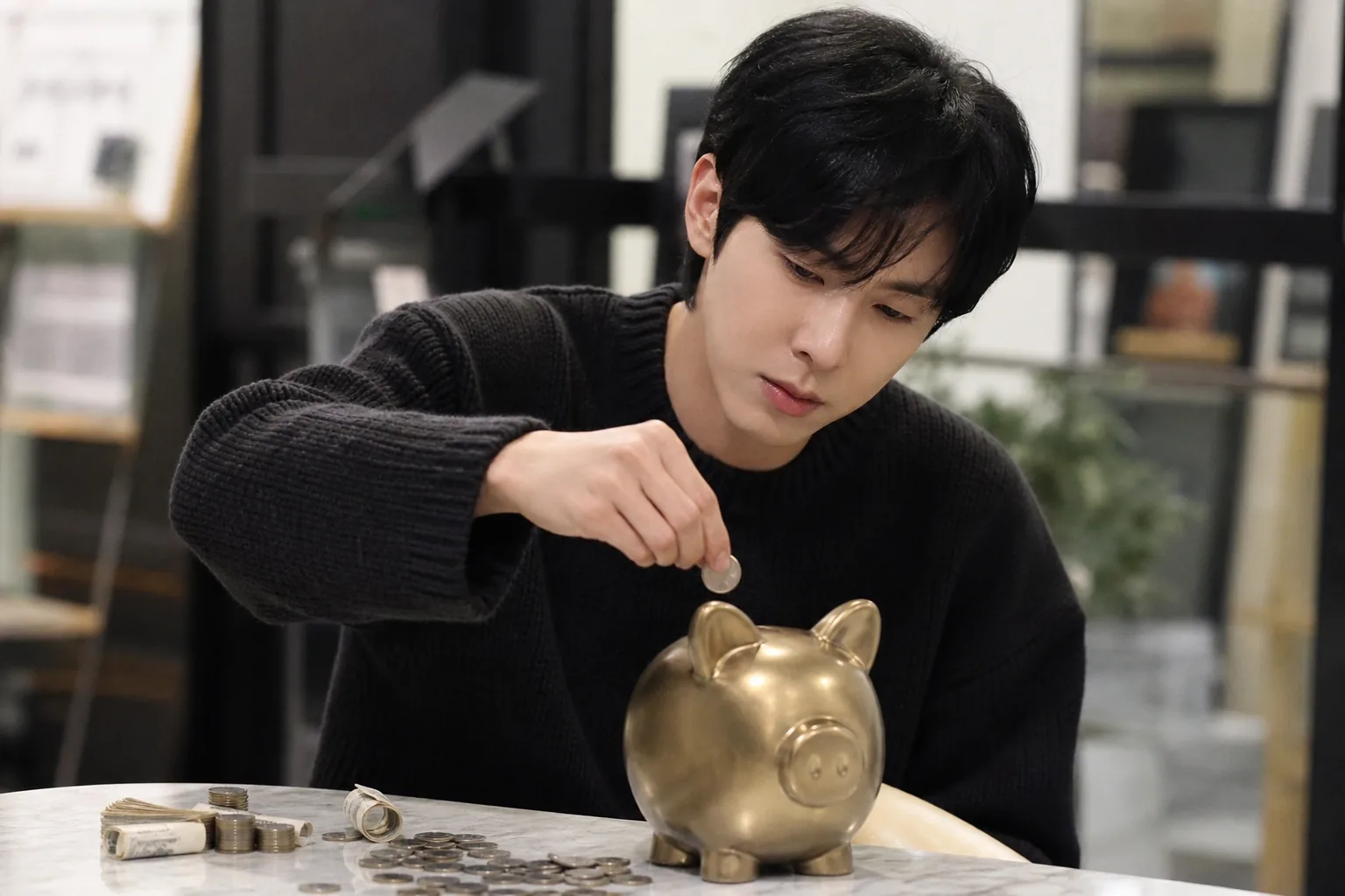 K-pop artist saving coins as reminder of early career hardship