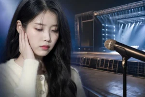Concert microphone under stage lights representing IU schedule changes