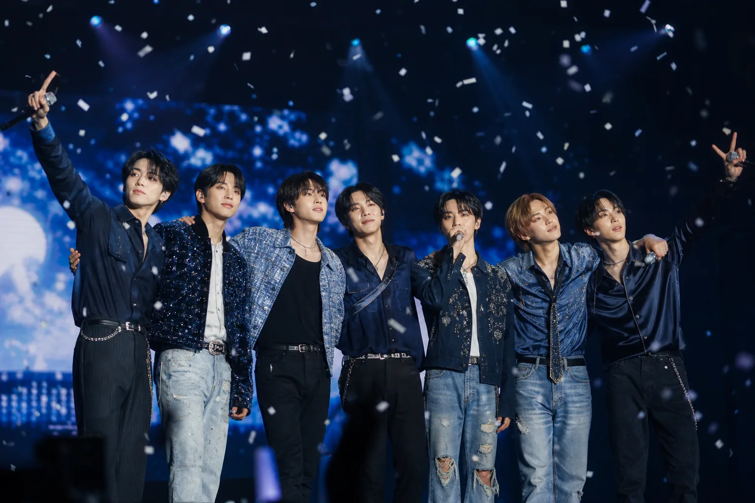 K-pop concert crowd showing long-term fan support for an idol group