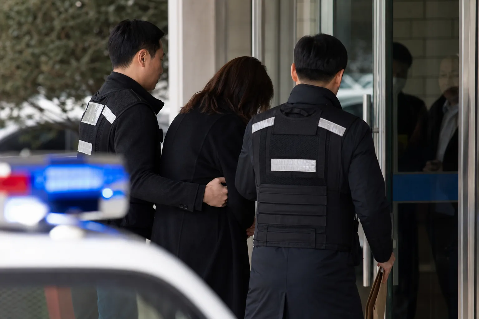 Investigators reviewing financial records in an entertainment-related fraud case