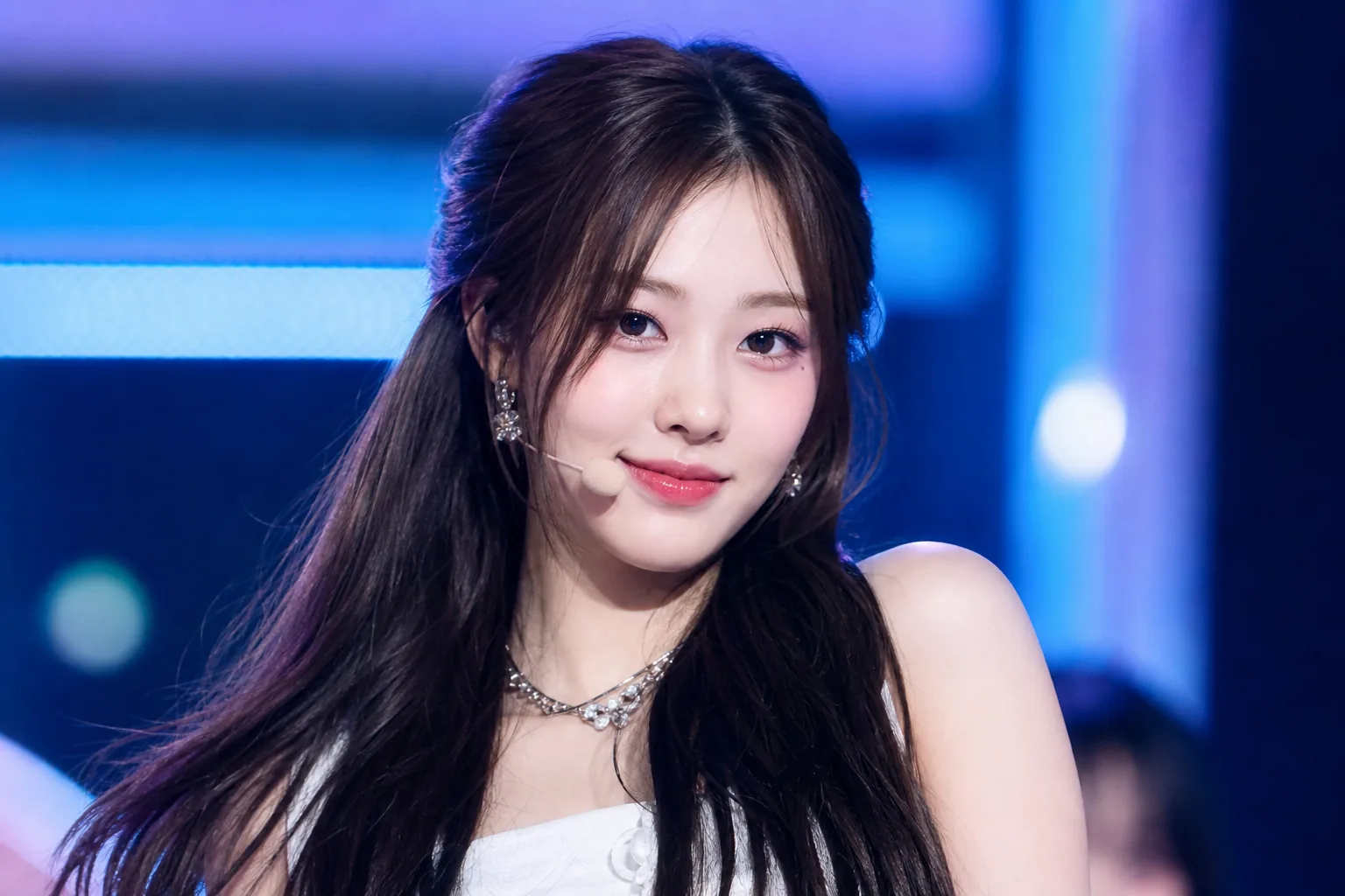 K-pop stage lights and fan engagement data representing July idol rankings