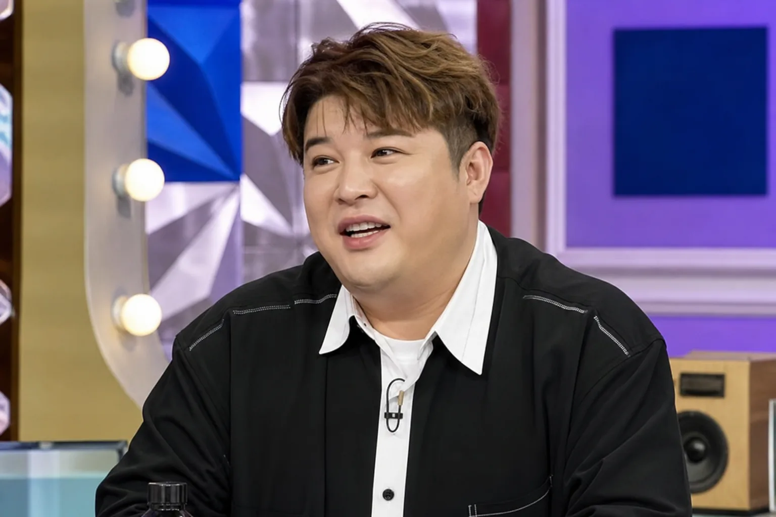 K-pop entertainer preparing for television schedule in a studio