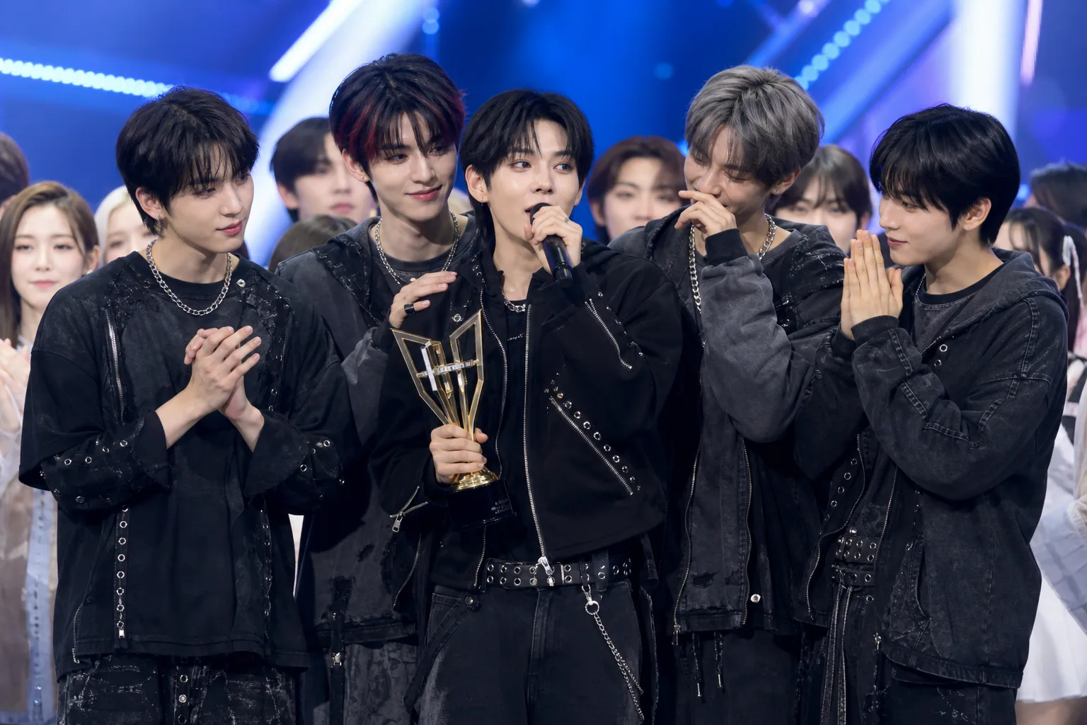 K-pop rookie group victory moment on a televised music show stage