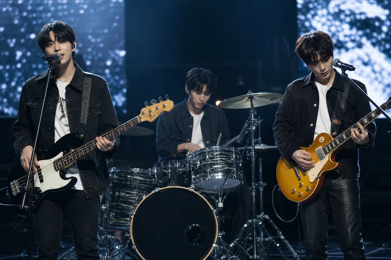 Three-member band rehearsal scene after temporary lineup change