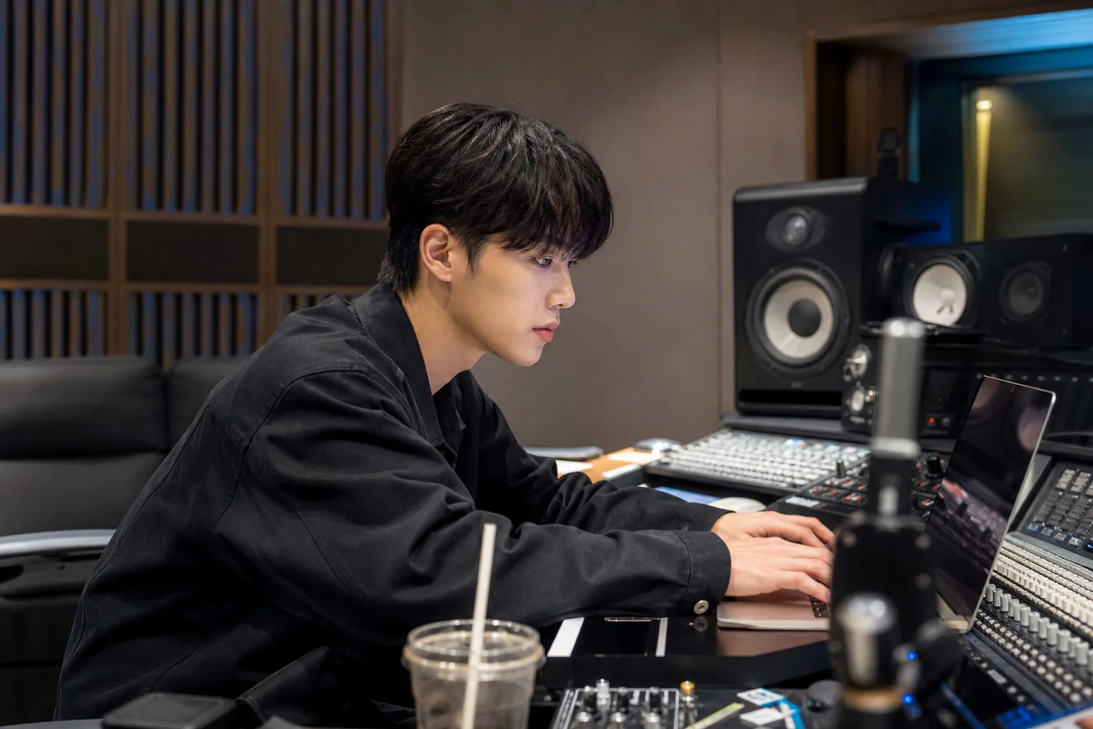 AI editorial image of a K-pop solo track being reviewed in a music studio