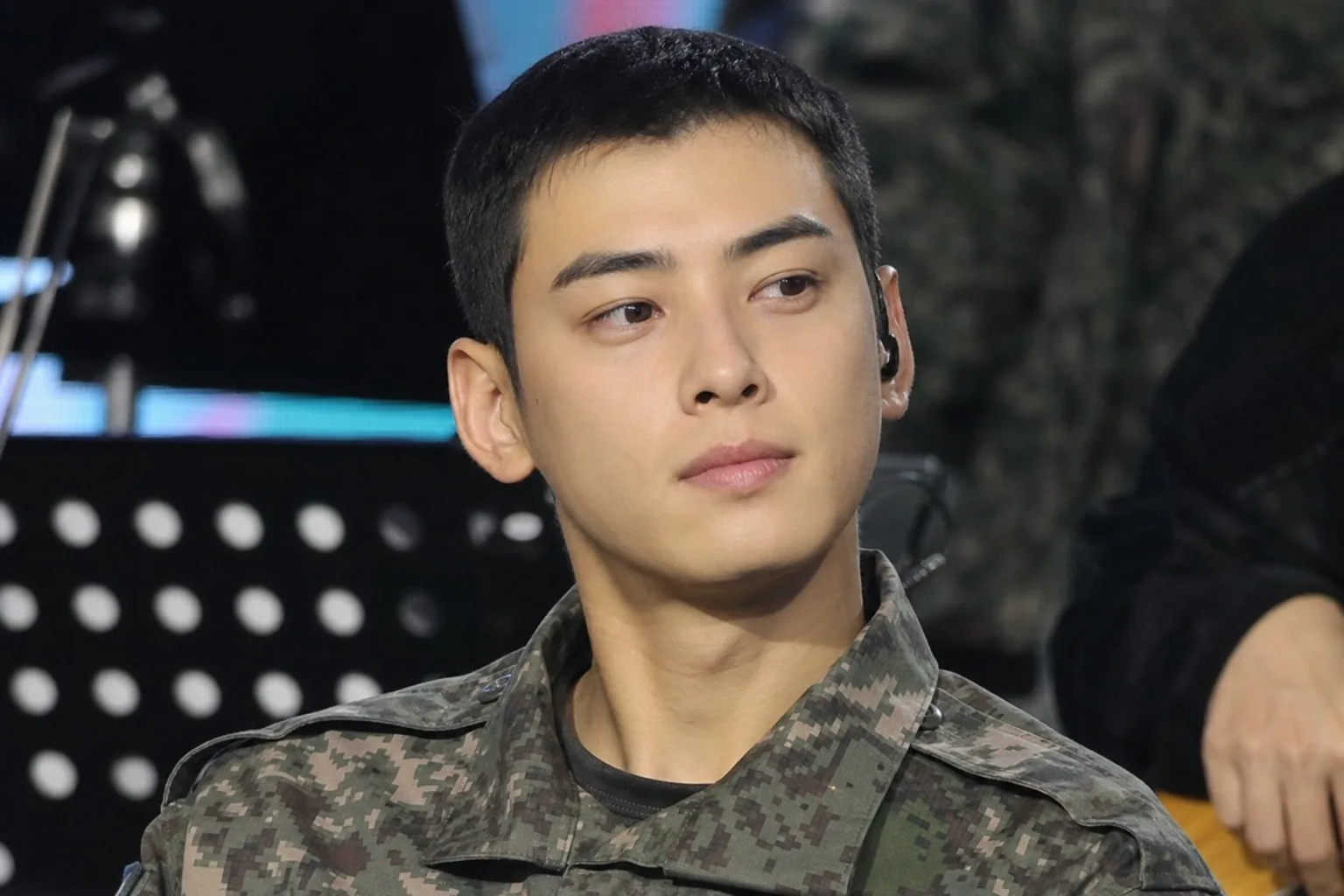 Traditional military concert stage representing Cha Eunwoo public appearance discussion