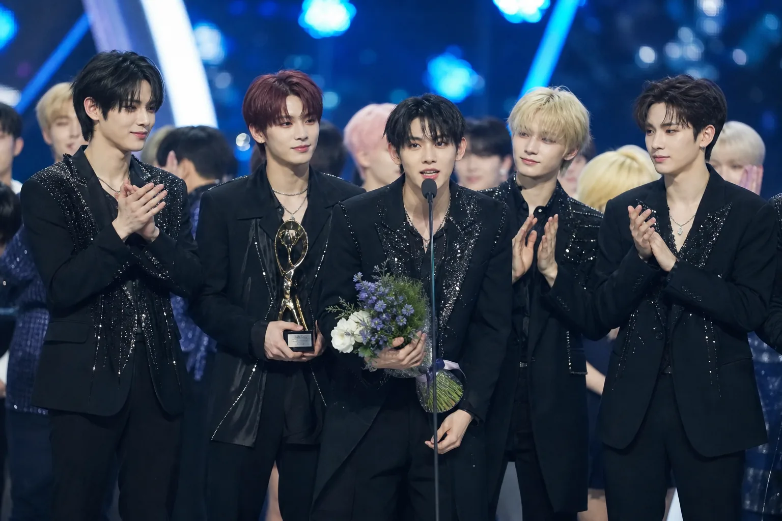 K-pop concert crowd representing fan voting and rising artists at Korean music awards