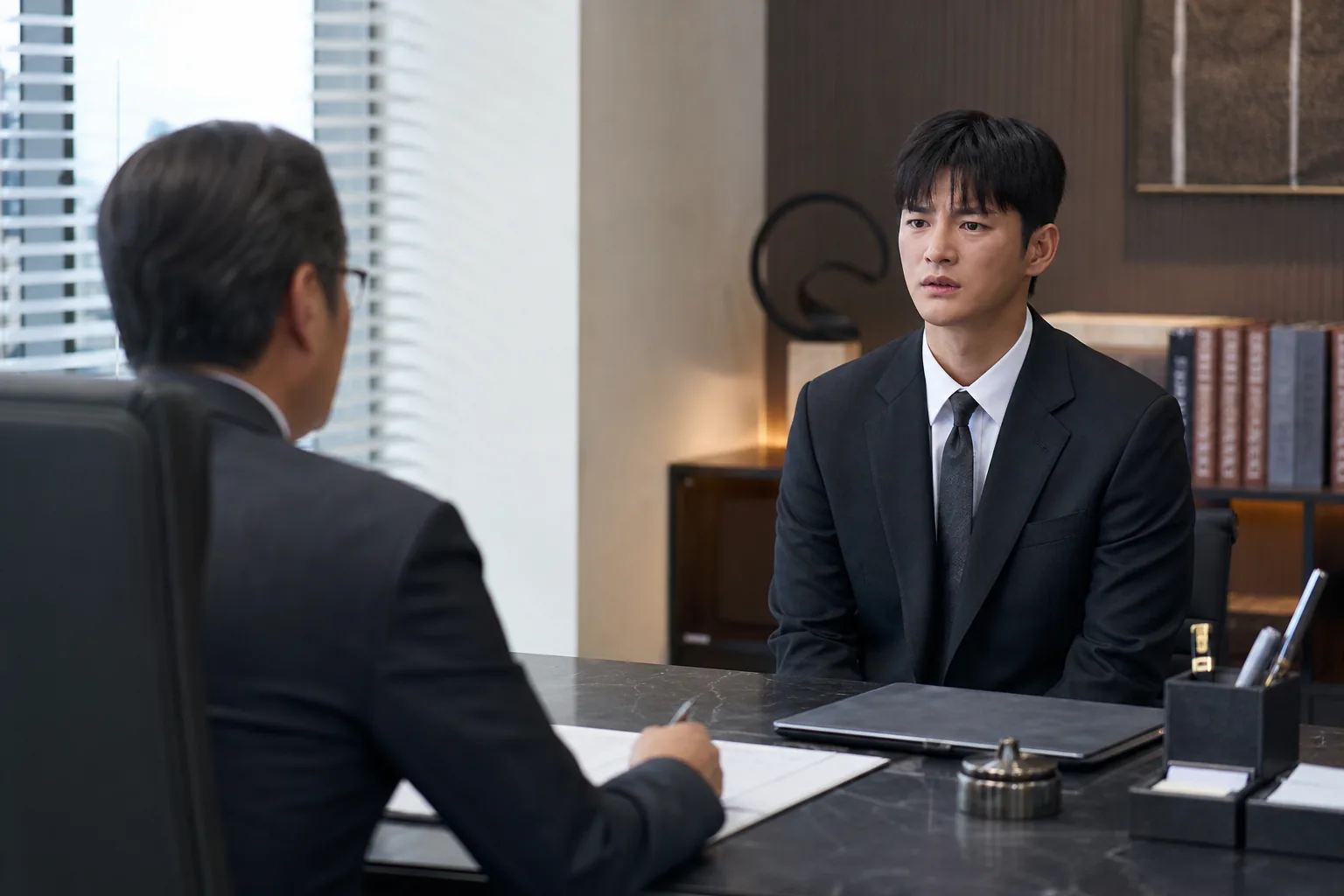 Tense office meeting visualizing Kang Si Woo facing pressure over a workplace relationship