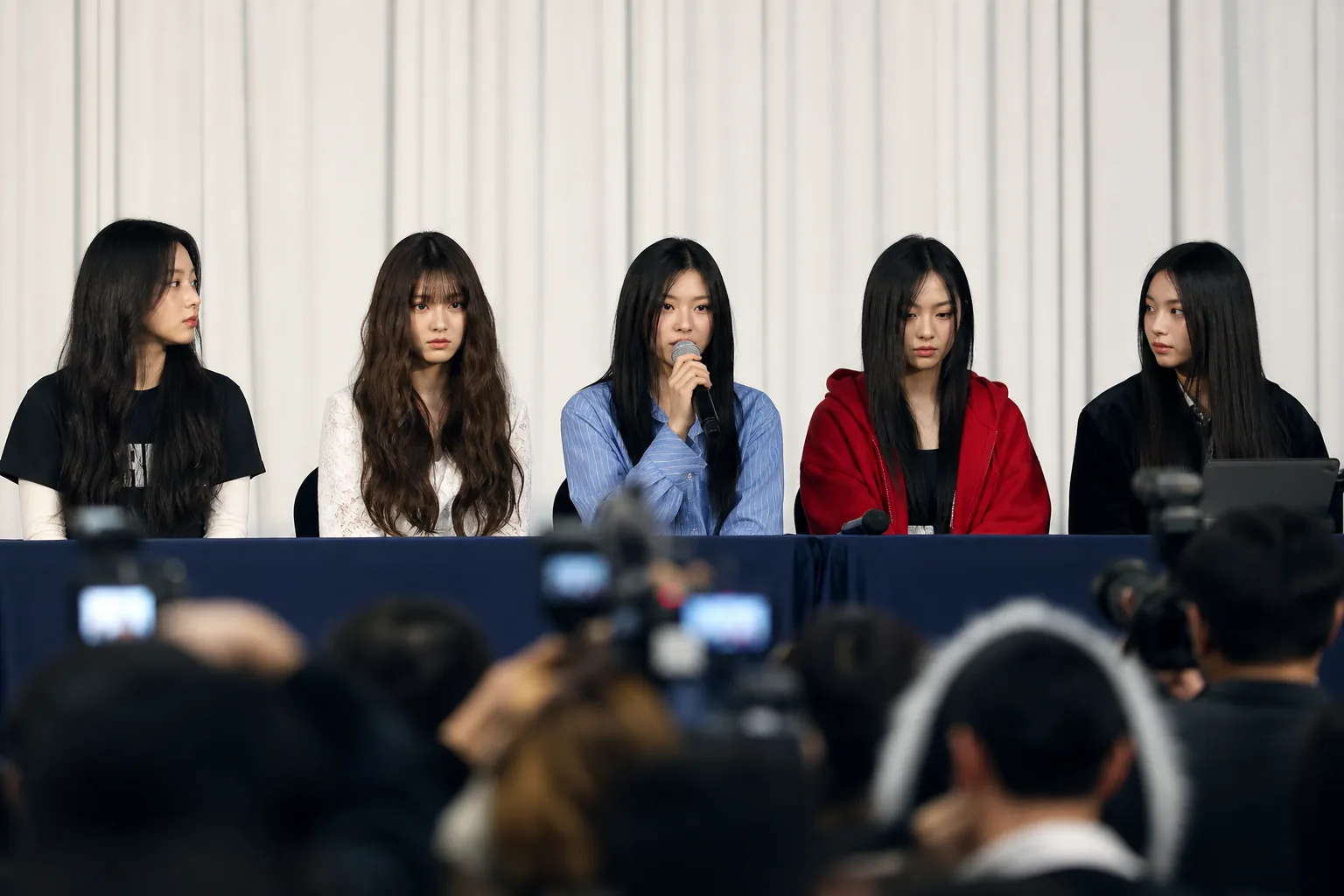 AI editorial image of entertainment company staff preparing a K-pop comeback behind the scenes
