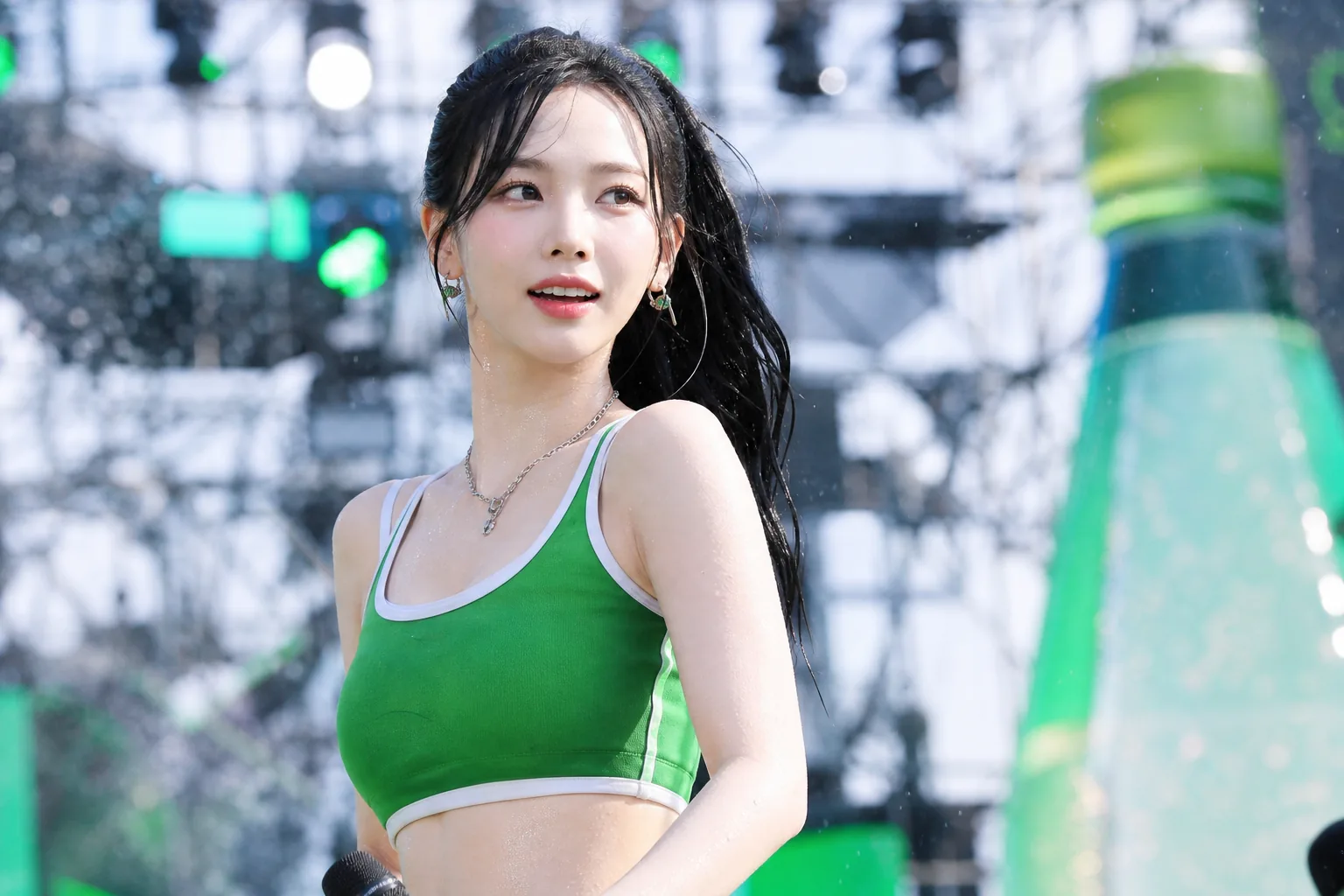 K-pop idol summer festival performance with water-themed stage lighting
