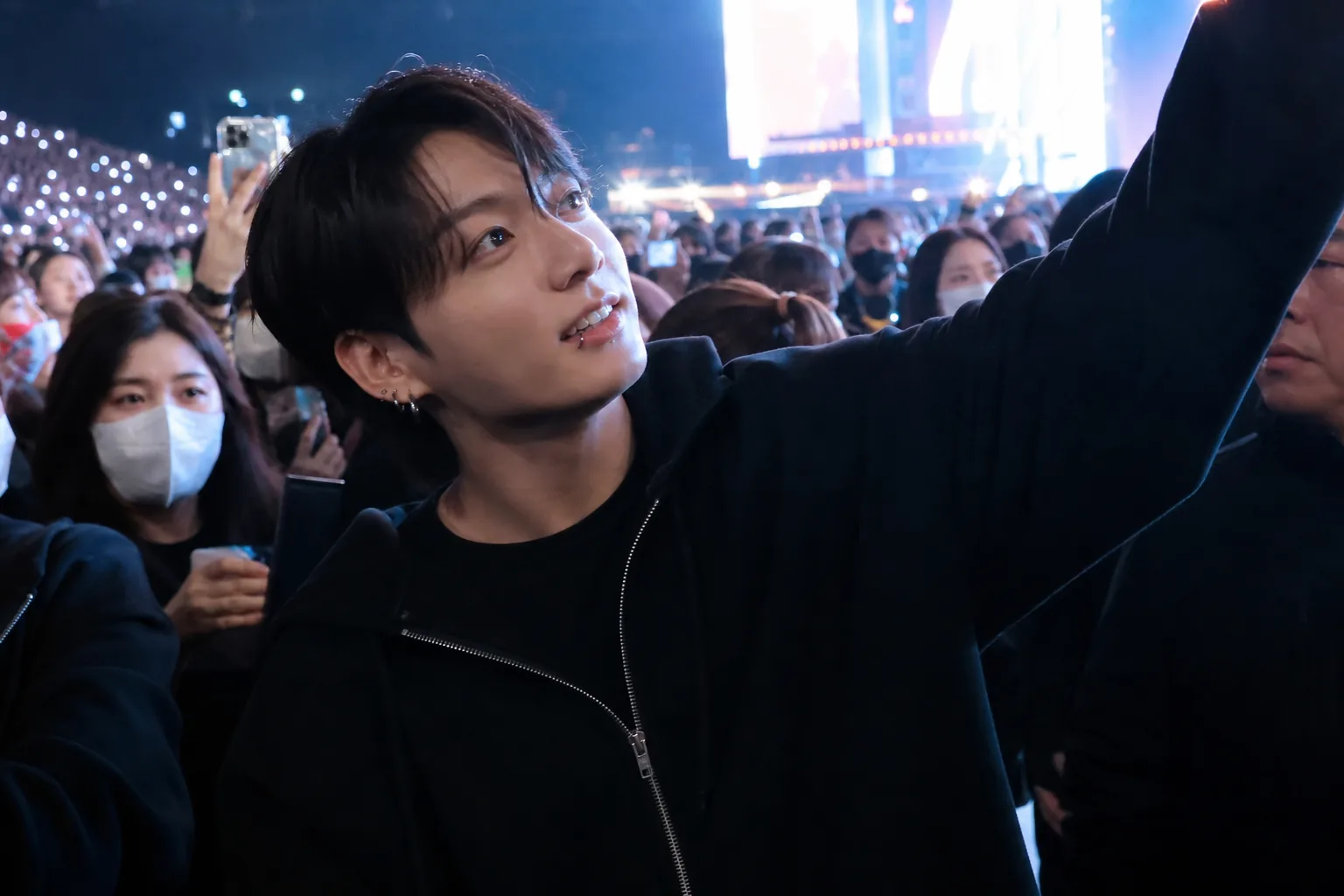 Concert stage lights and fan phones capturing a viral K-pop concert moment