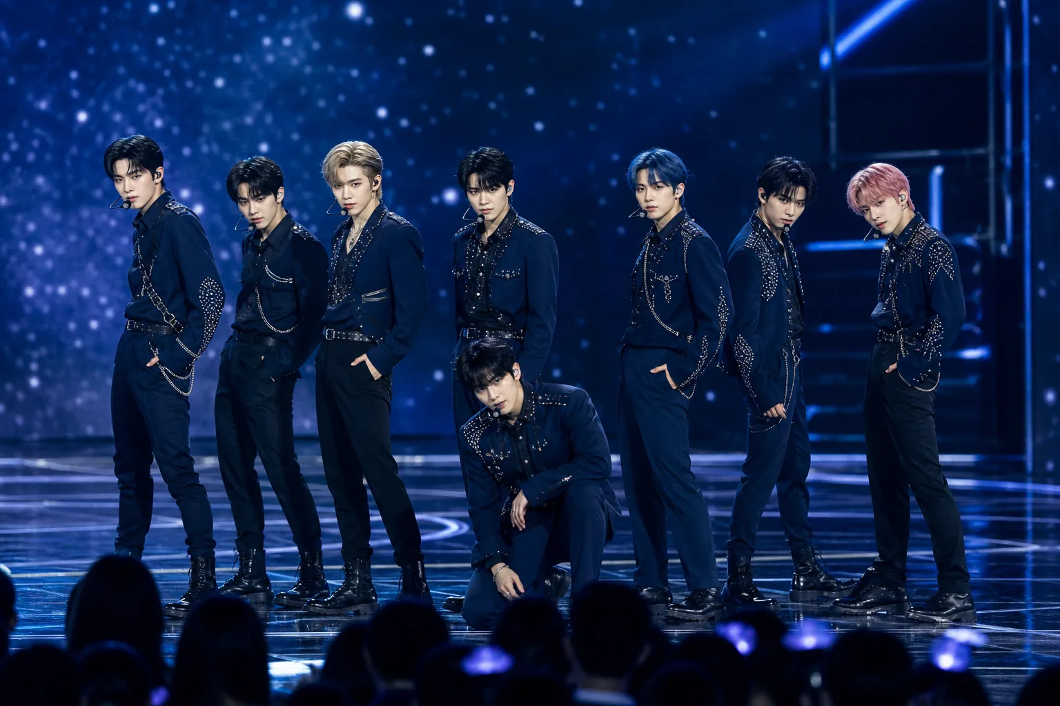 K-pop group stage planning with one member absent due to acting schedule