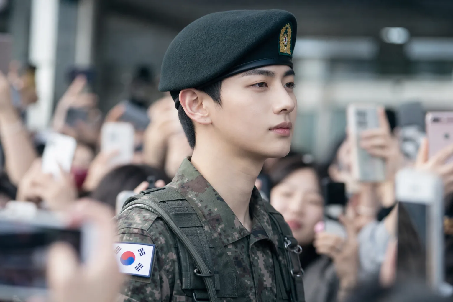 K-pop trainee career crossroads with military service and stage performance themes