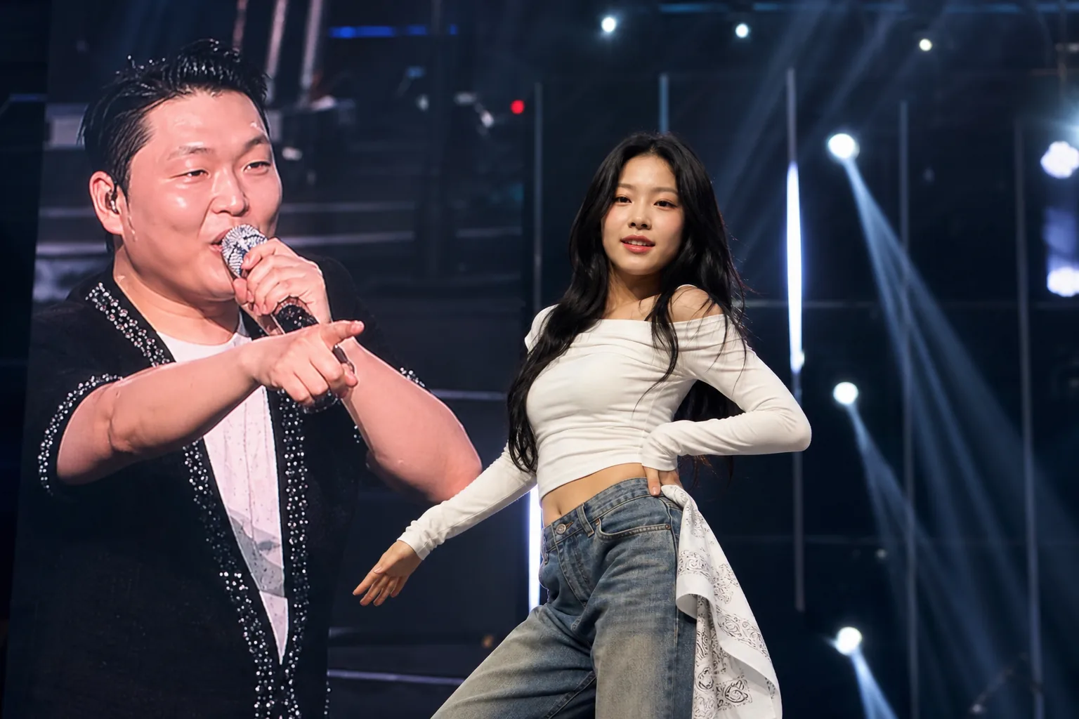 Aspiring K-pop dancer performing confidently during a live concert crowd moment