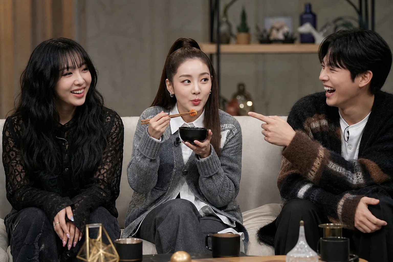 Variety show studio scene representing idols discussing food habits and group memories