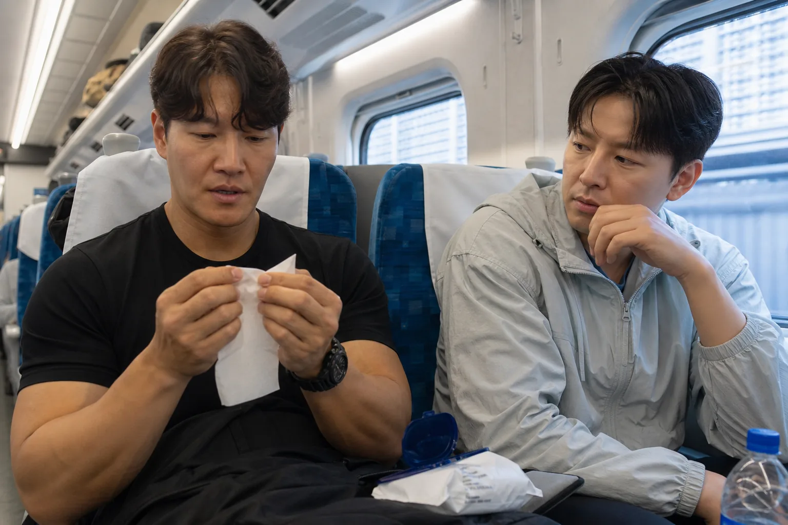 Travel essentials arranged for a Korean variety show trip about careful spending