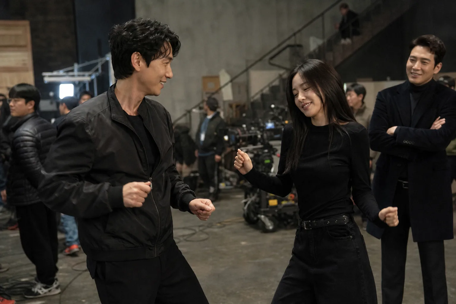 Actors preparing an action scene on a Korean drama set